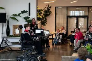 IMG_8472 Elizabeth Fust presenting to seated attendees.