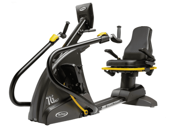 An exercise machine with a black frame and black seat that has arm handles and foot pedals for recumbent cardiovascular exercise.