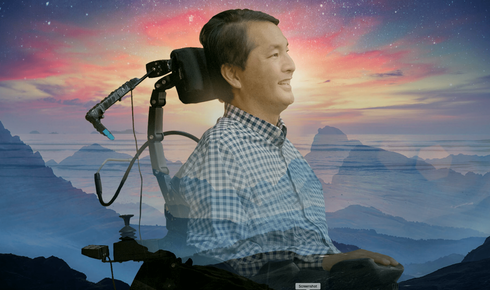 An Asian American man in profile, sitting in a power wheelchair with image of sunset and mountains behind him